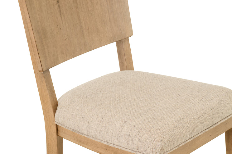 Wooden chair with beige cushioned seat on a white background